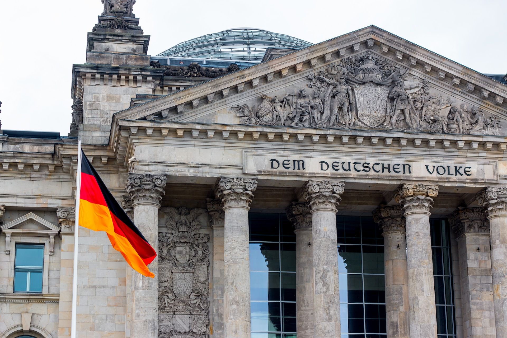 german flag in front of a government building
