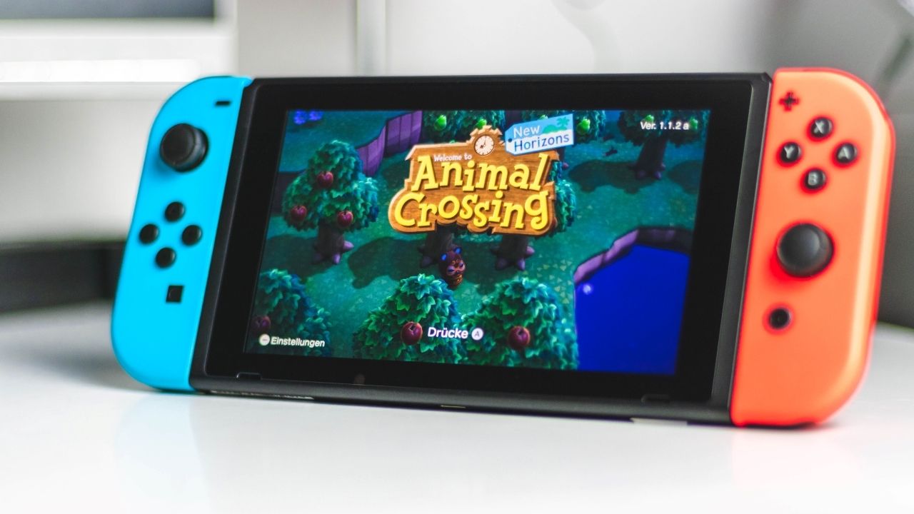 A photograph of a Nintendo Switch in Handheld Mode and running Animal Crossing 