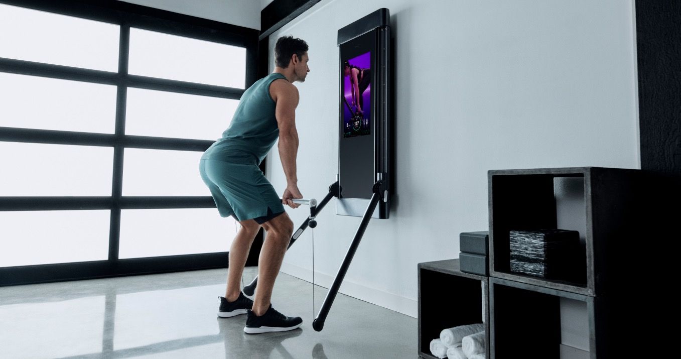 Man using Tonal home smart gym