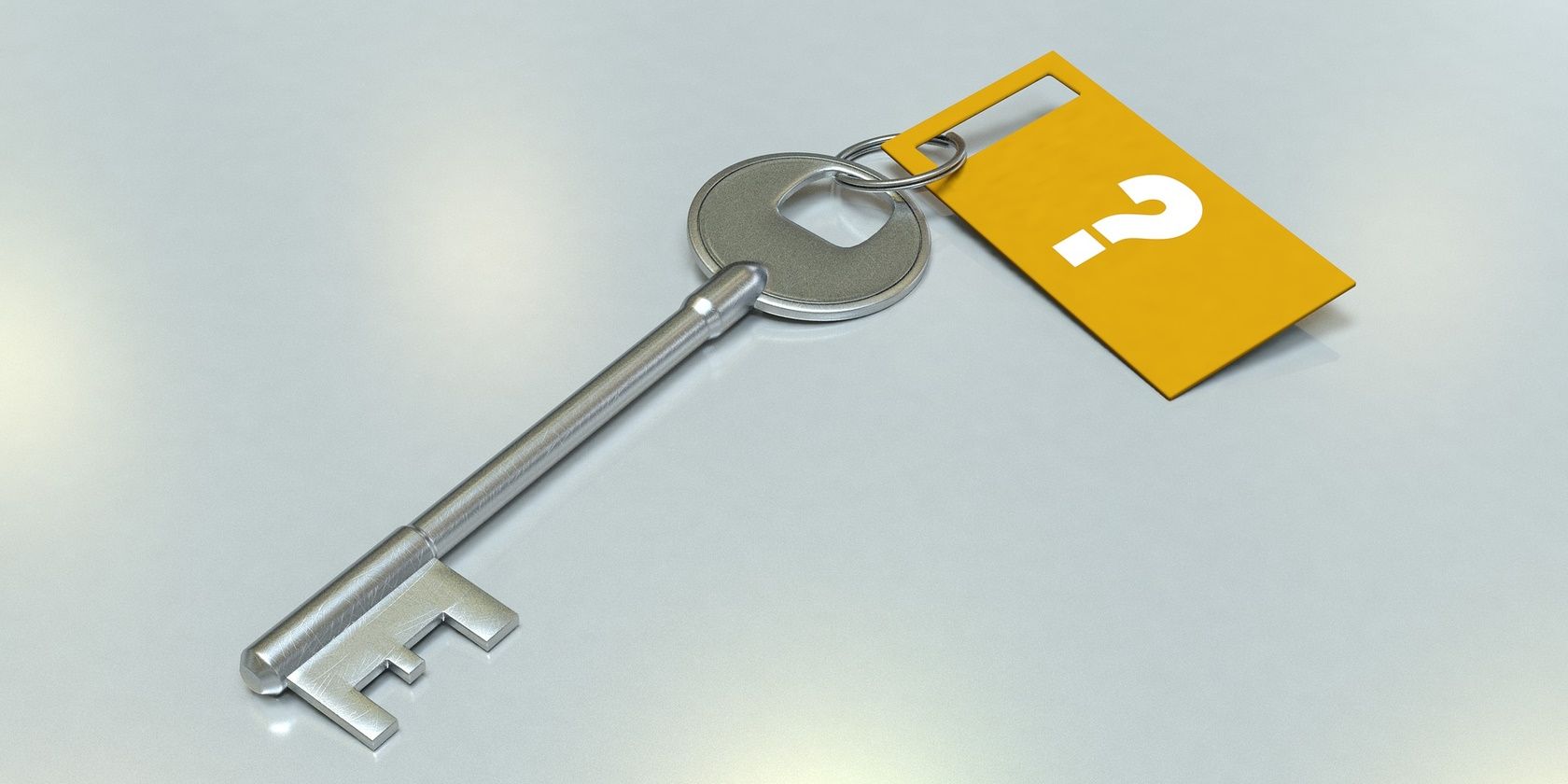 Card Having a Question Mark Attached to a Key