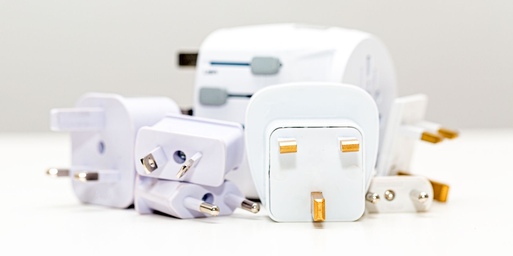 Various countries' plugs piled on top of each other