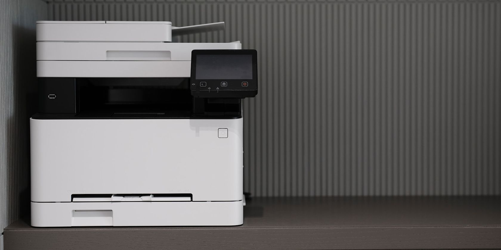 White printer on grey desk