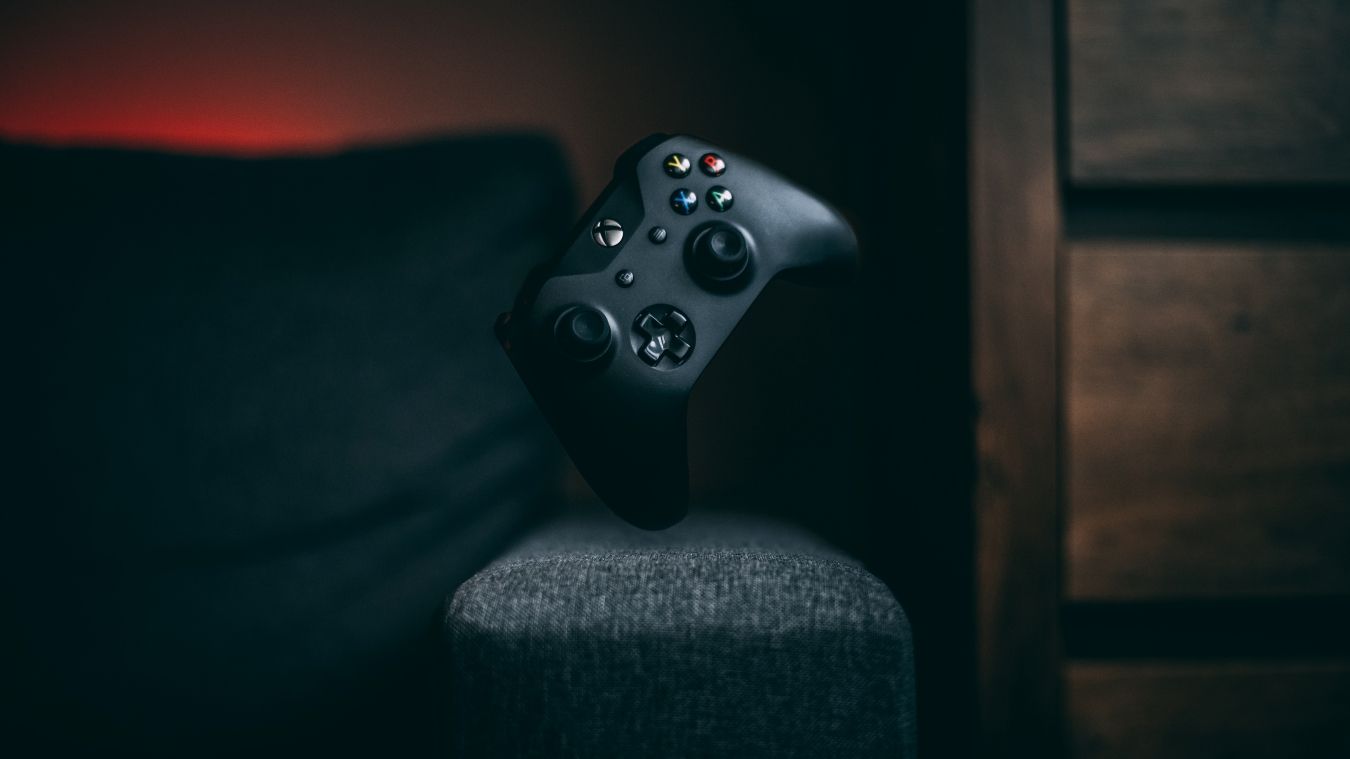 A photograph of a standard black Xbox One controller 