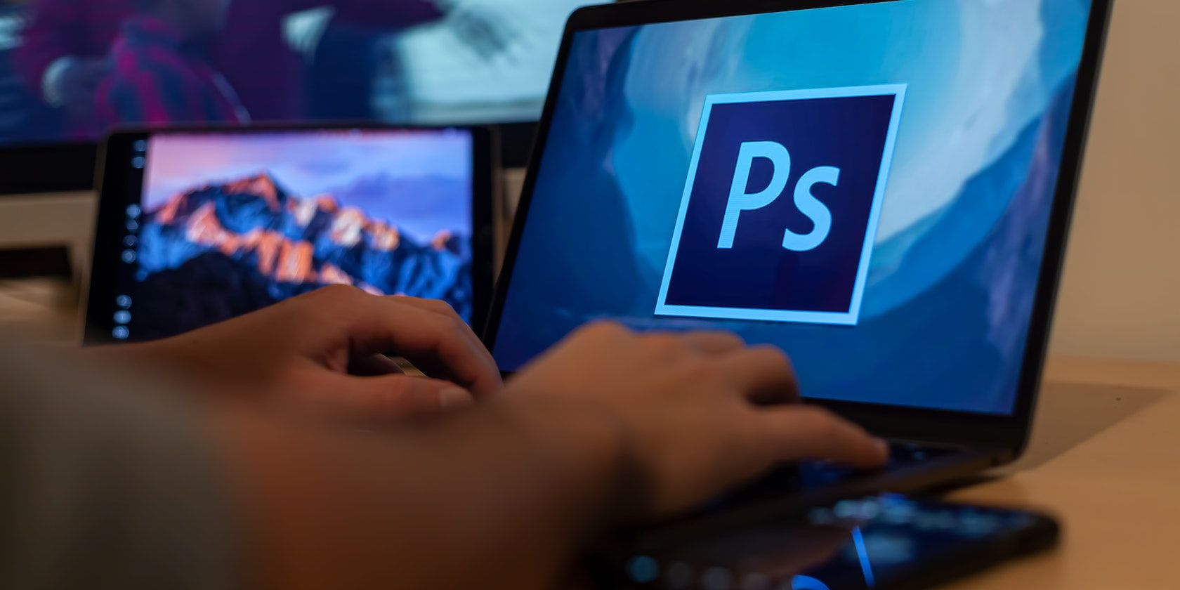 A Person Using Adobe Photoshop On A Windows Laptop