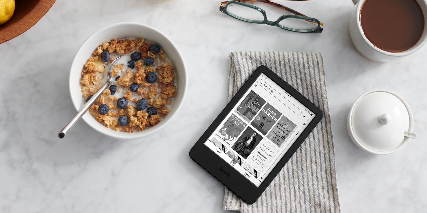 Amazon Kindle on a white breakfast table