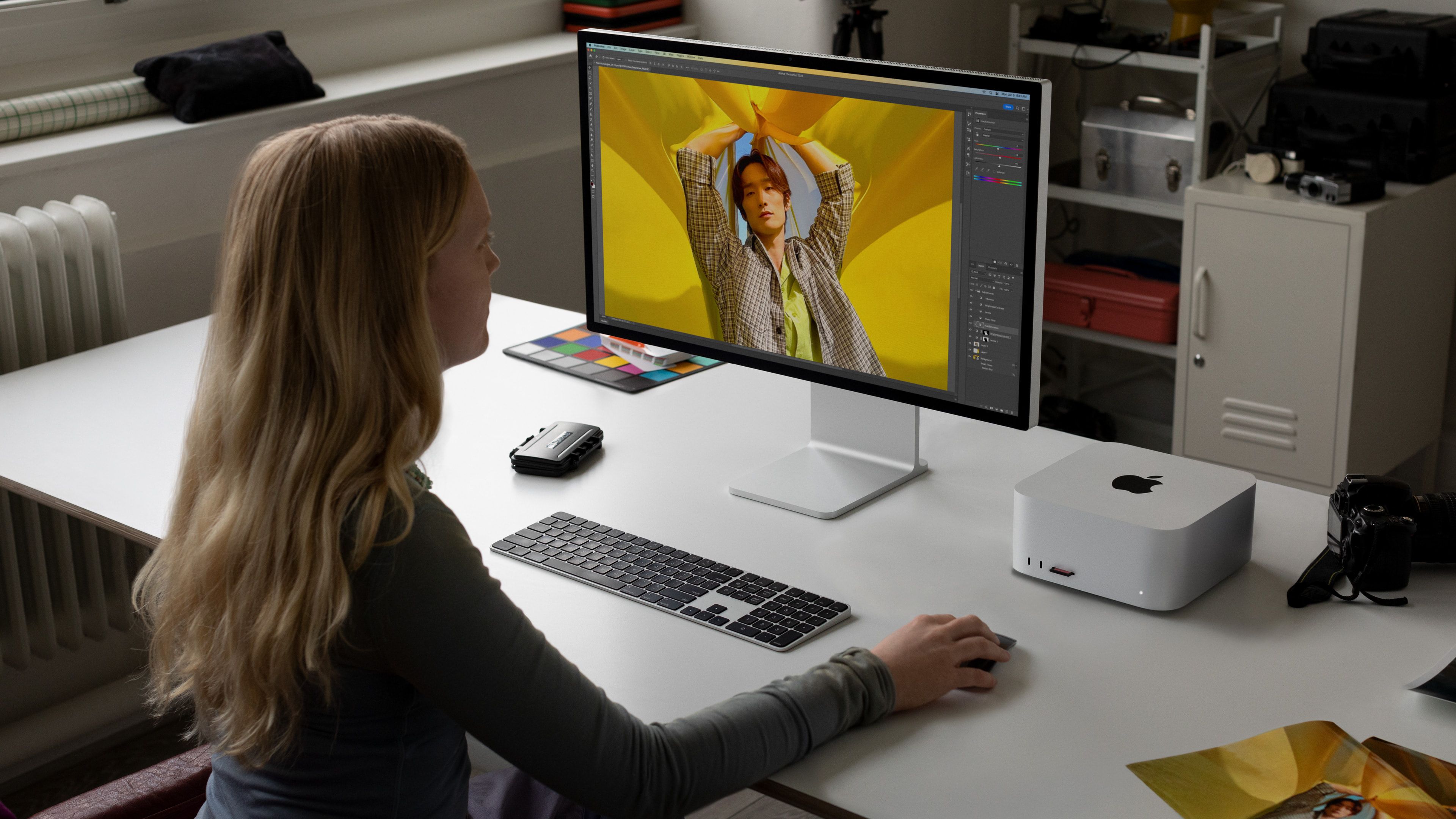 A woman using the Apple Mac Studio