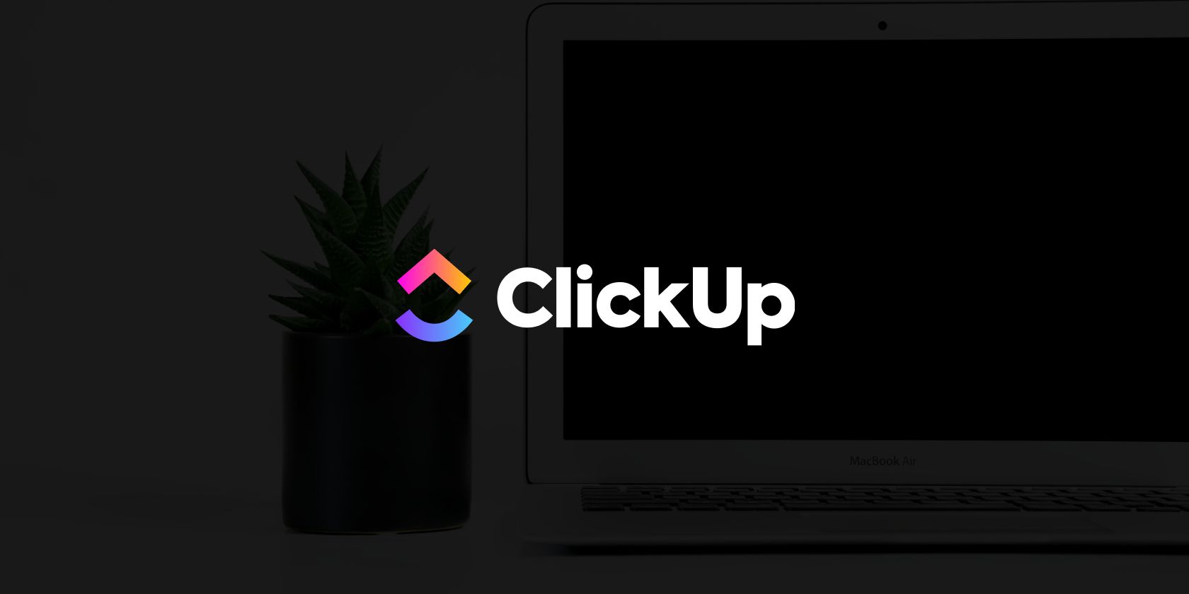 ClickUp logo over a laptop on a desk with a plant on a black background
