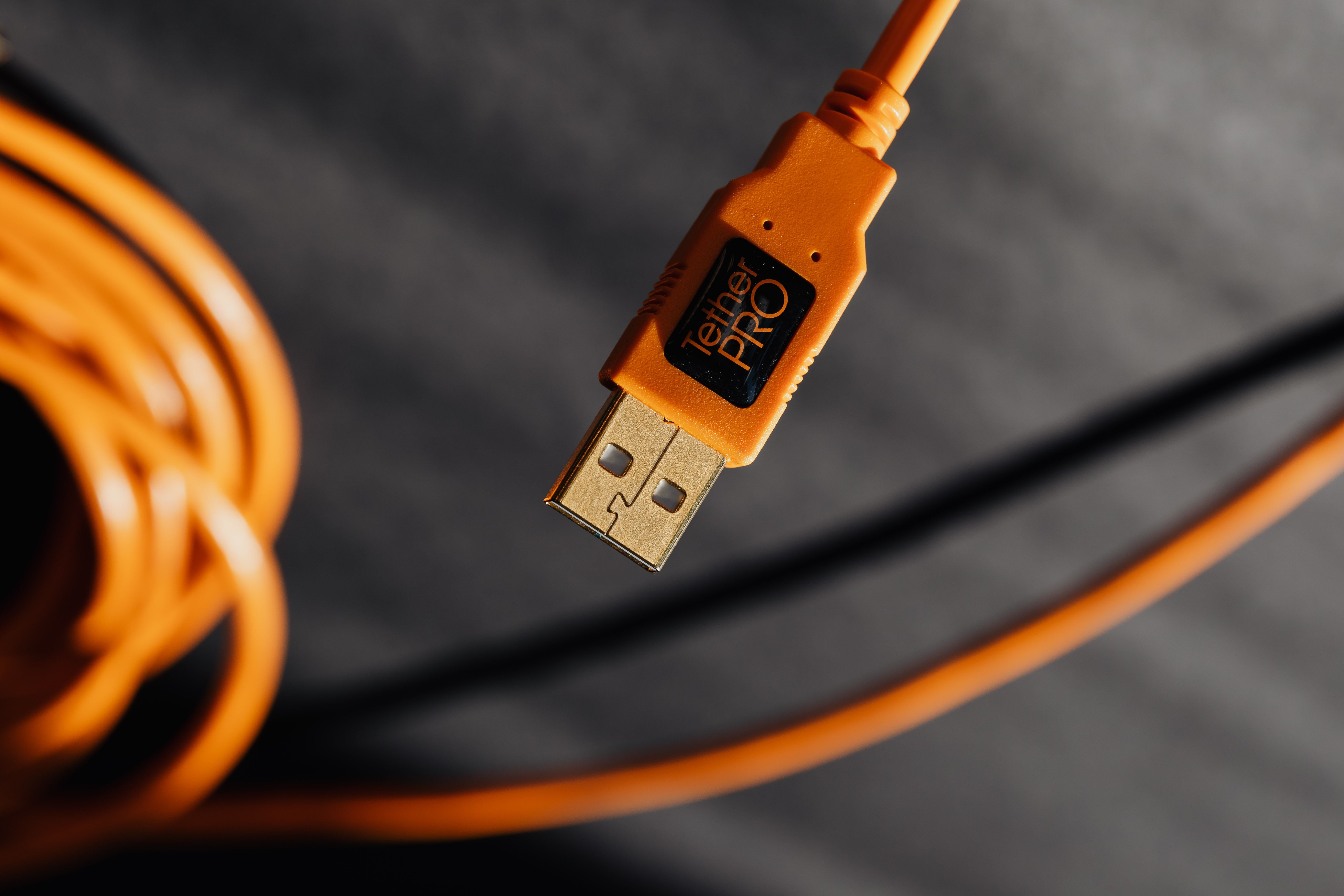 Close-up of orange USB cable