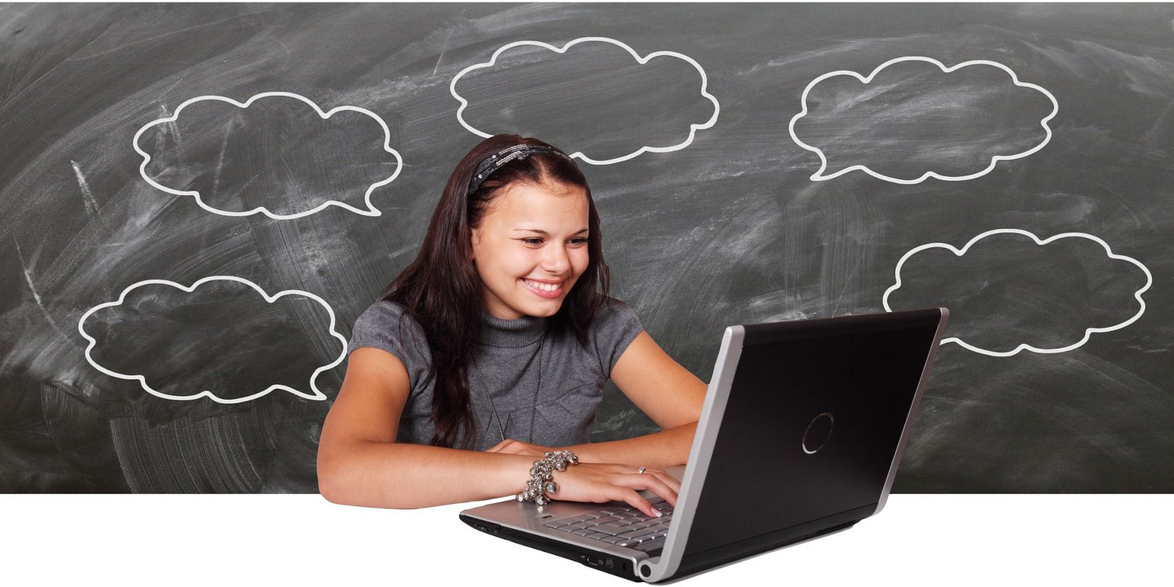 lady smiling at laptop with cloud drawings around her