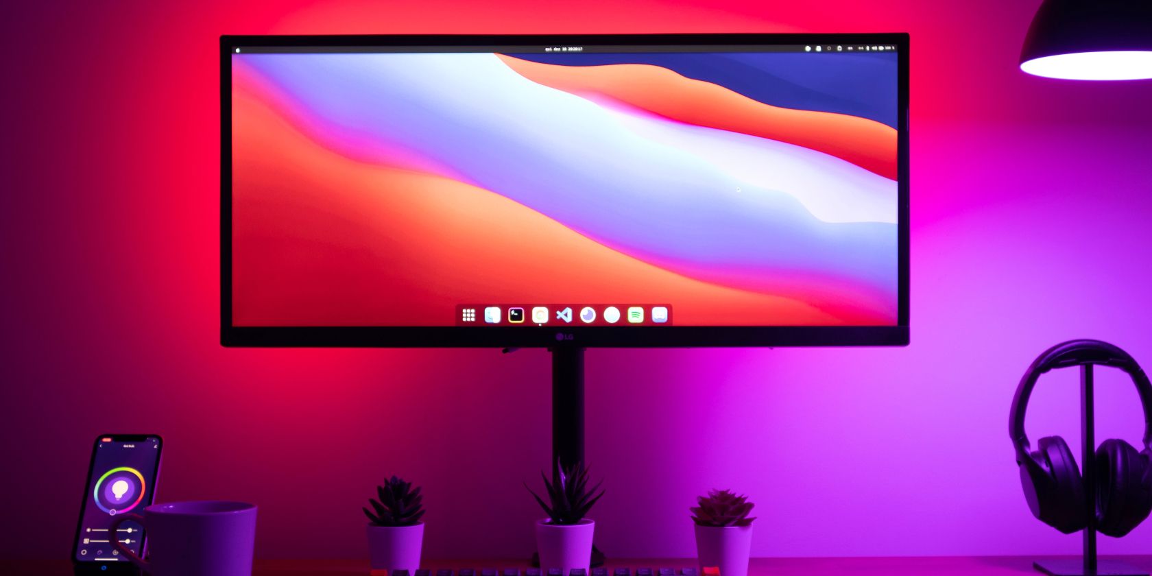 RGB lights against a wall behind a monitor