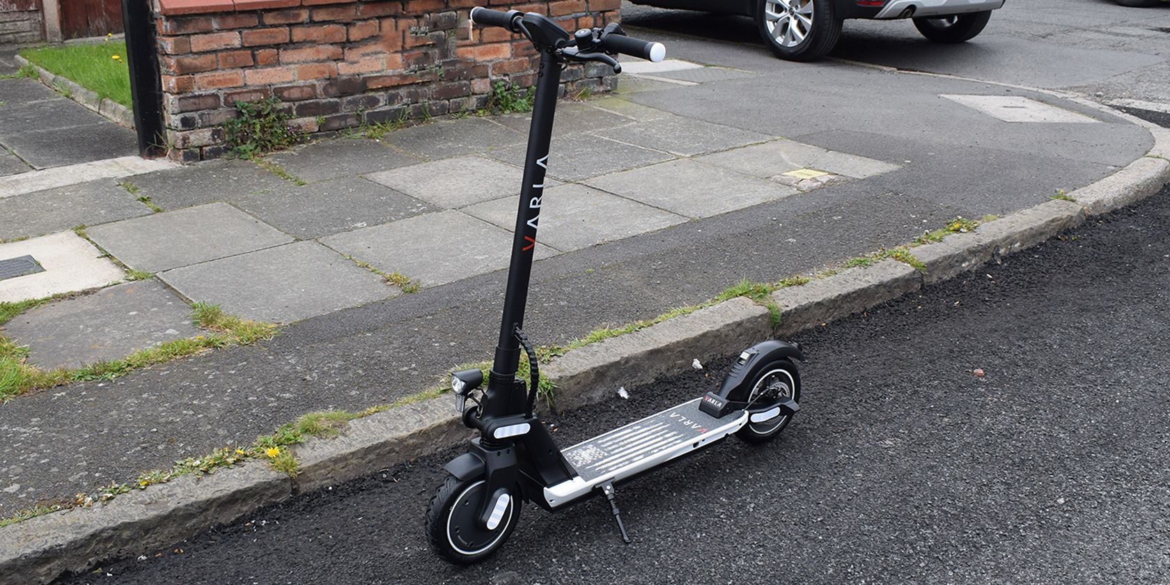 Varla Wasp electric scooter standing up on road
