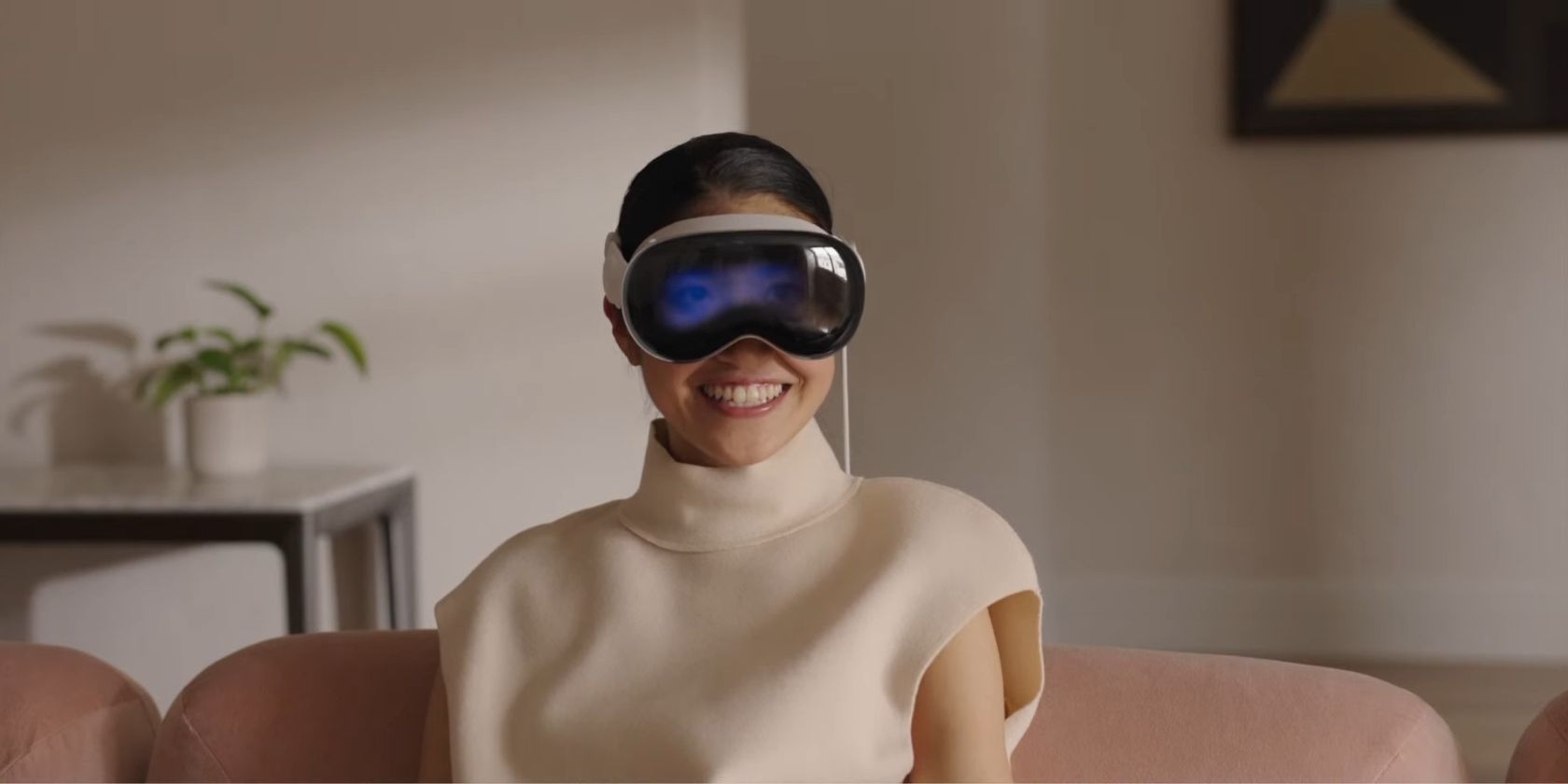 Woman wearing Apple Vision Pro headset smiling