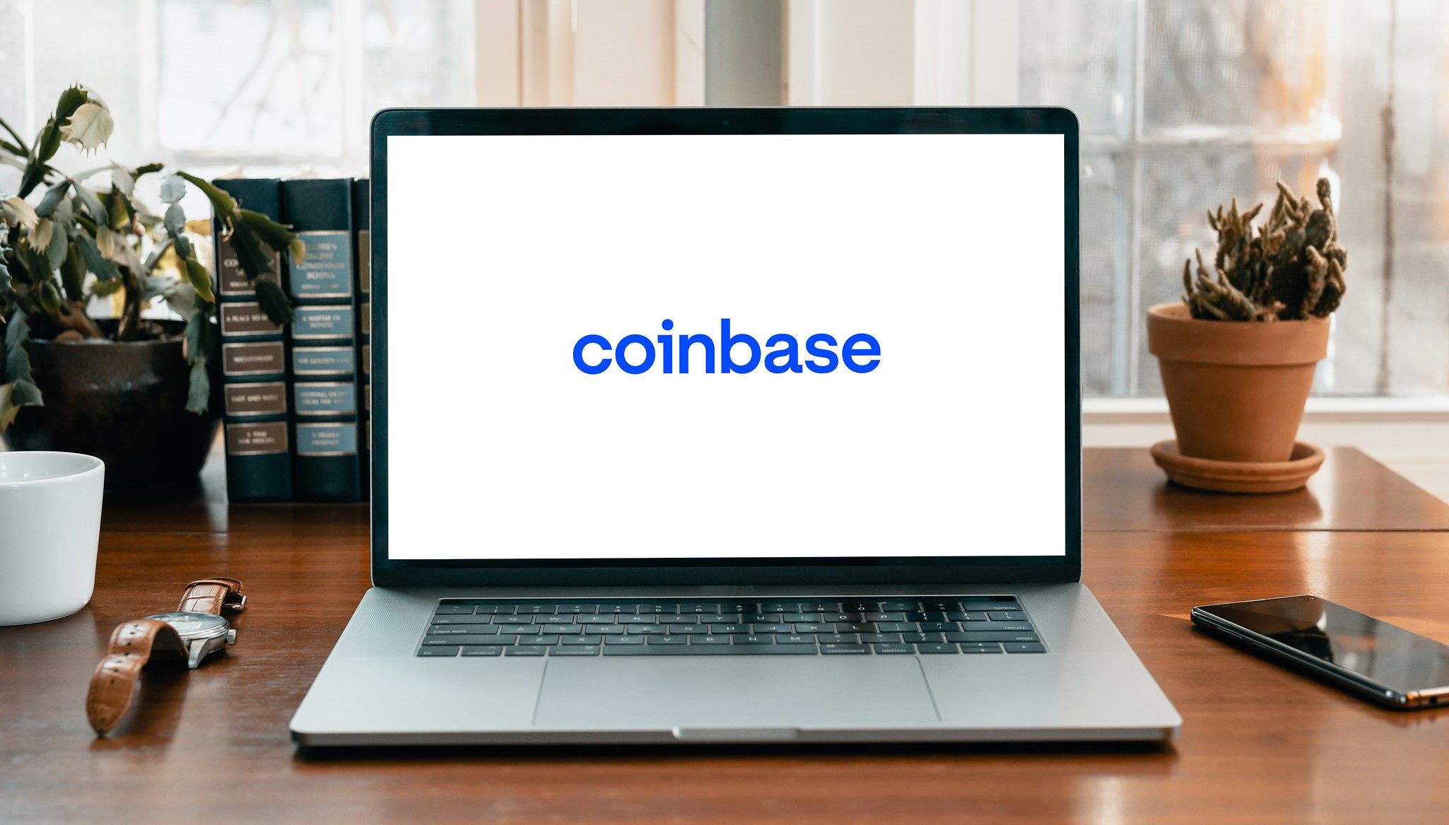 logo coinbase trên màn hình máy tính xách tay