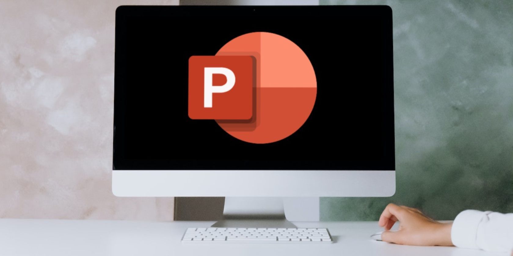 PowerPoint logo on iMac placed on a desk