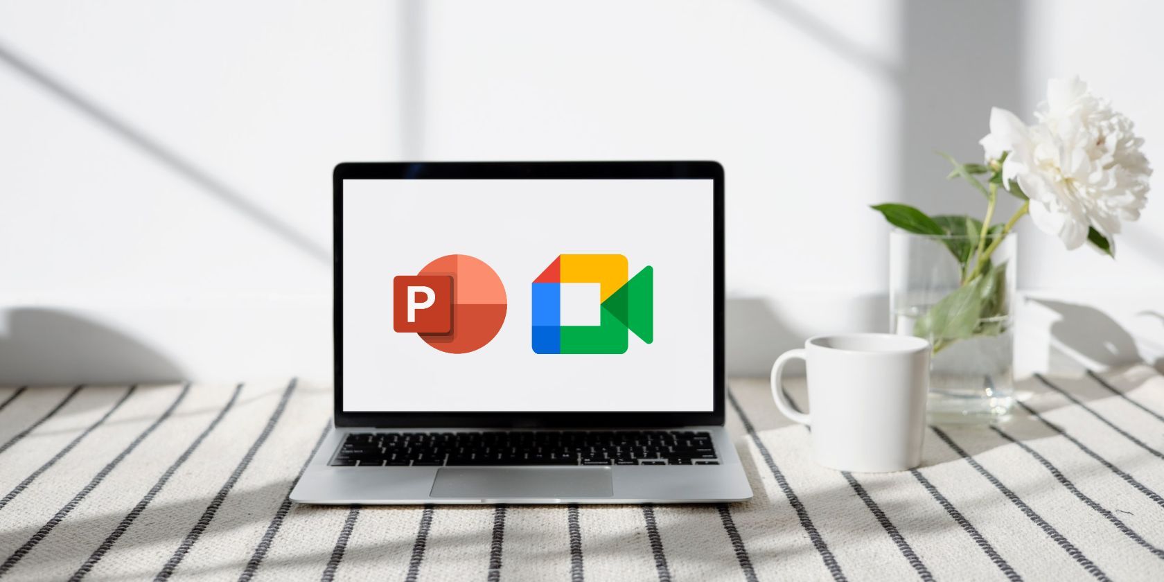 PowerPoint and Google Meet logos on a laptop