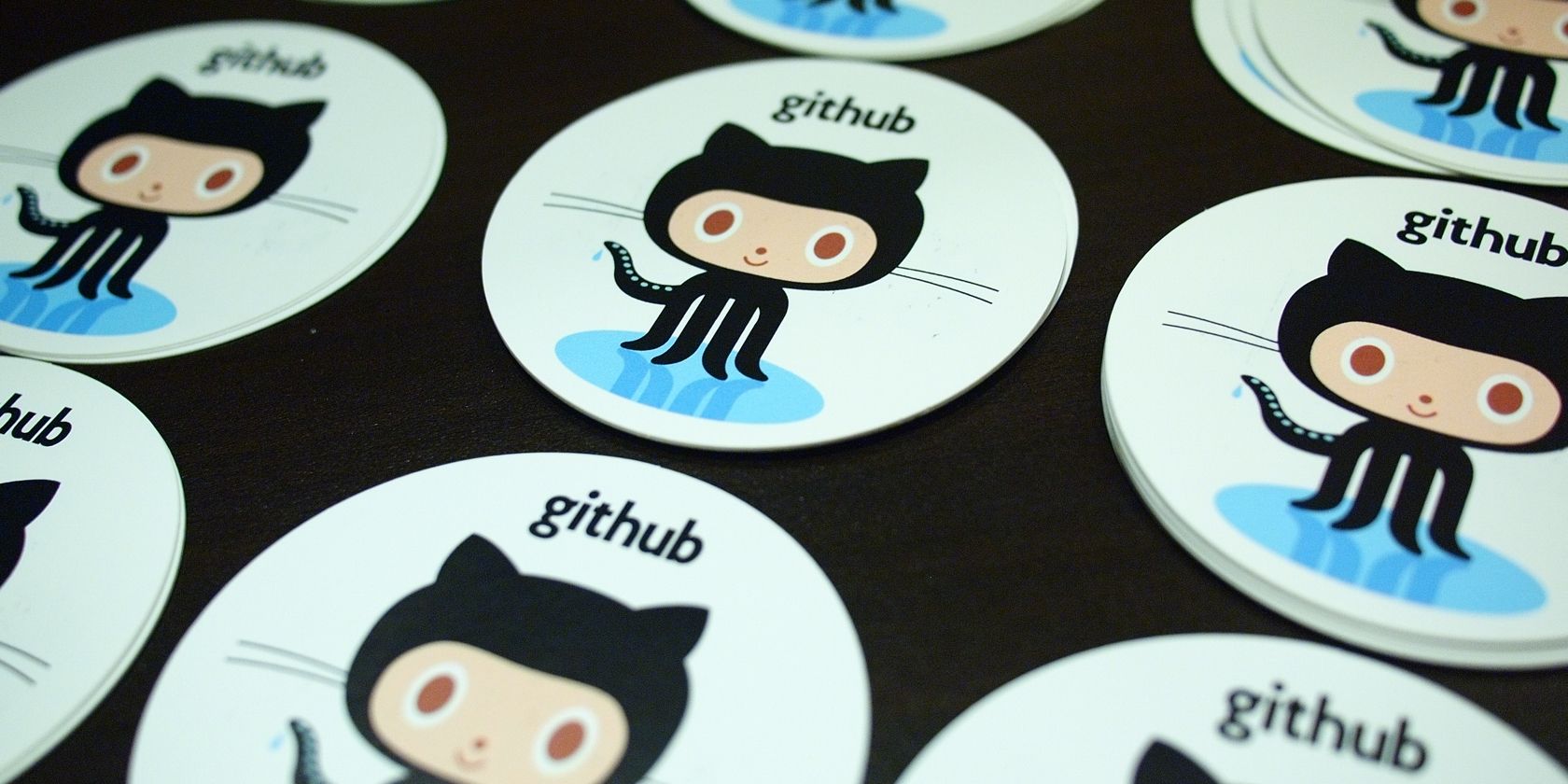 github octocat stickers laid across table