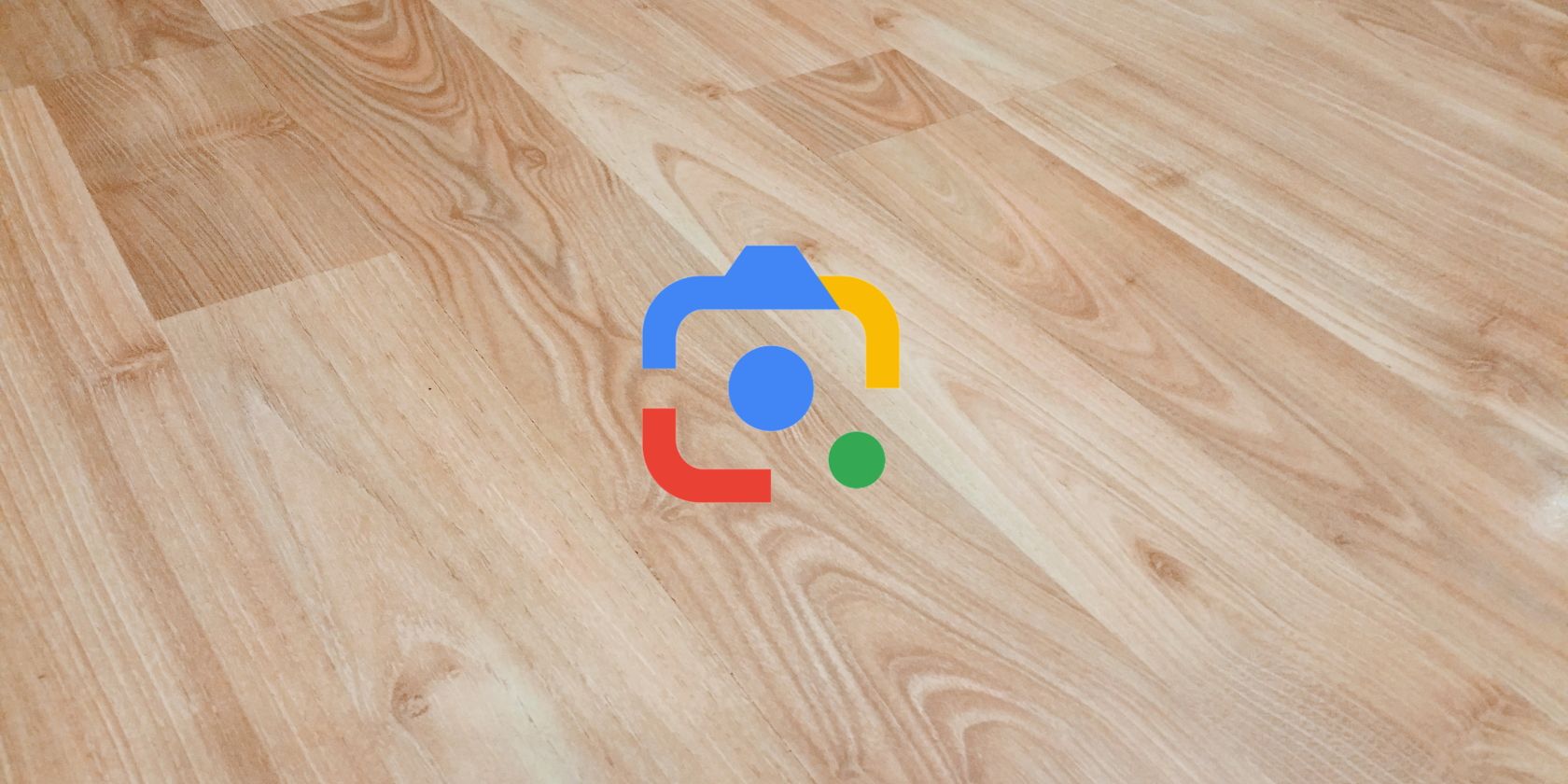 Google Lens logo on wooded table