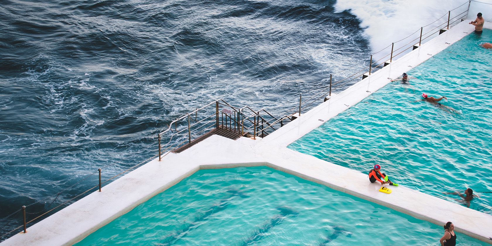Large swimming pool beside an ocean
