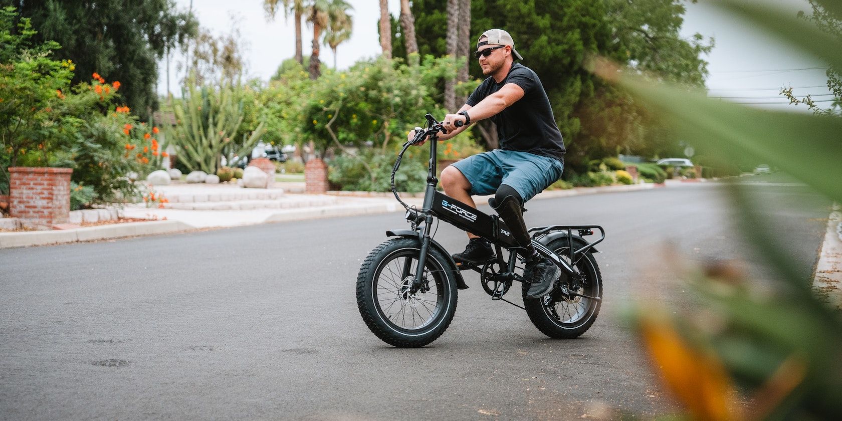 man with a prosthetic leg riding an ebike