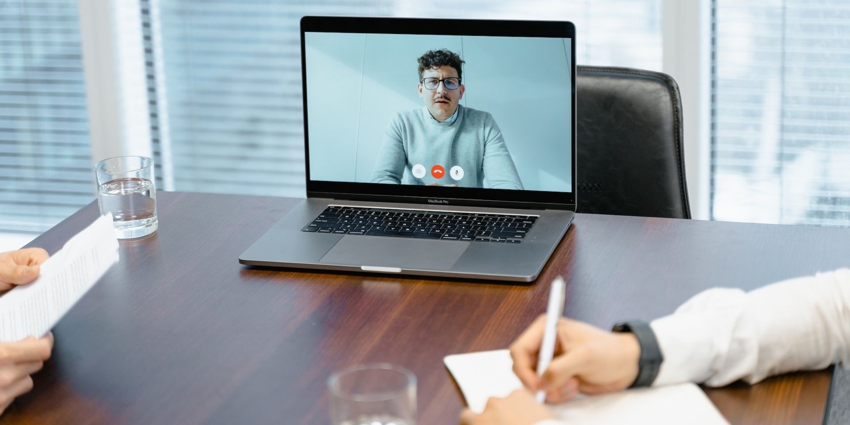 Two people in an online meeting