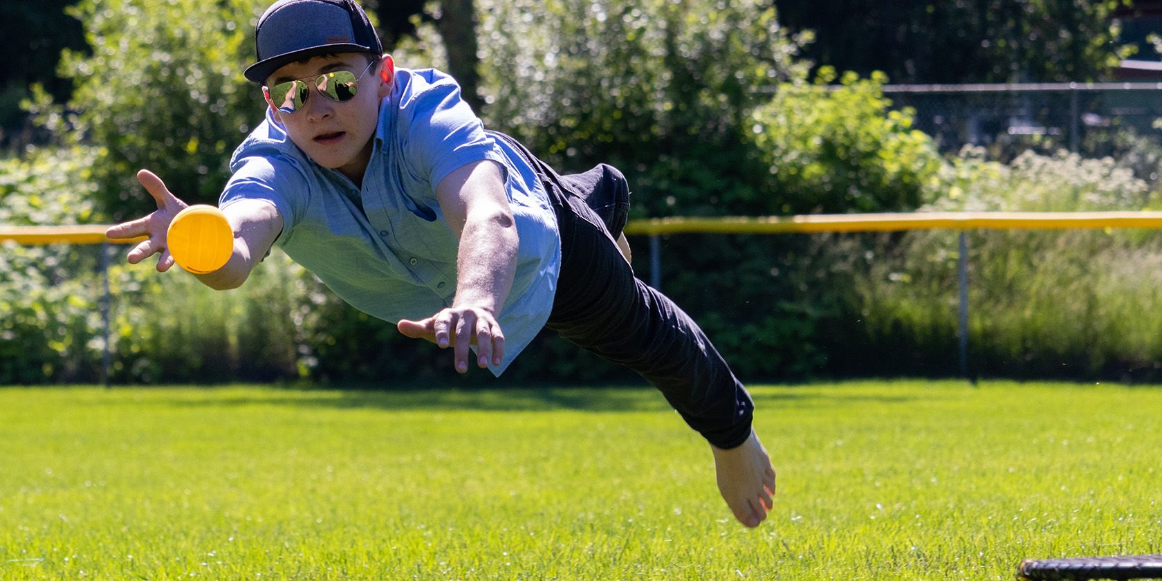 Person diving during a Spikeball game