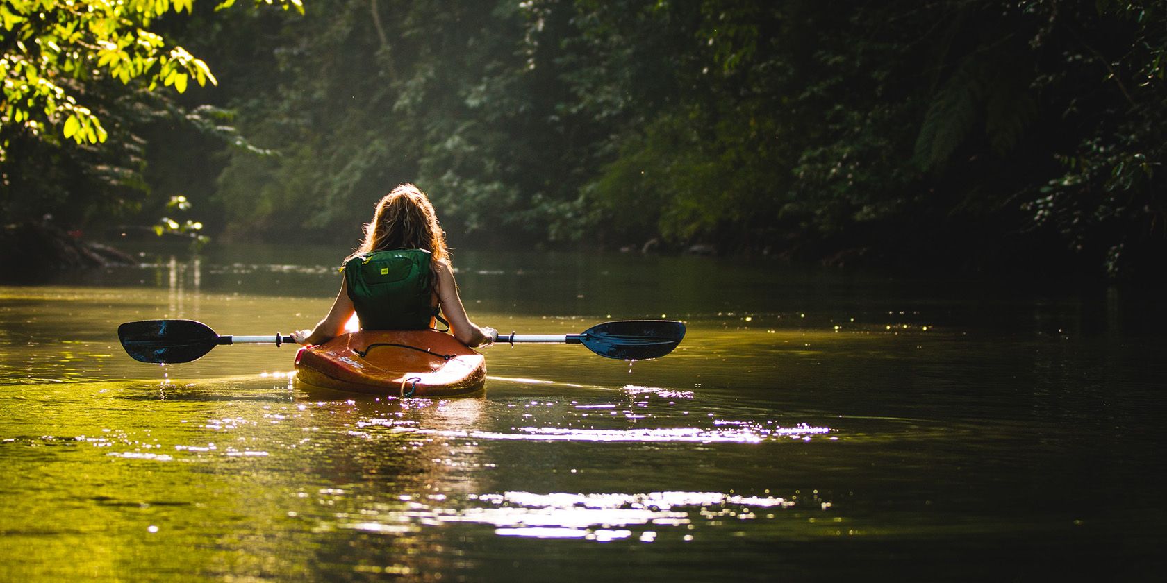 Person kayaking in a river