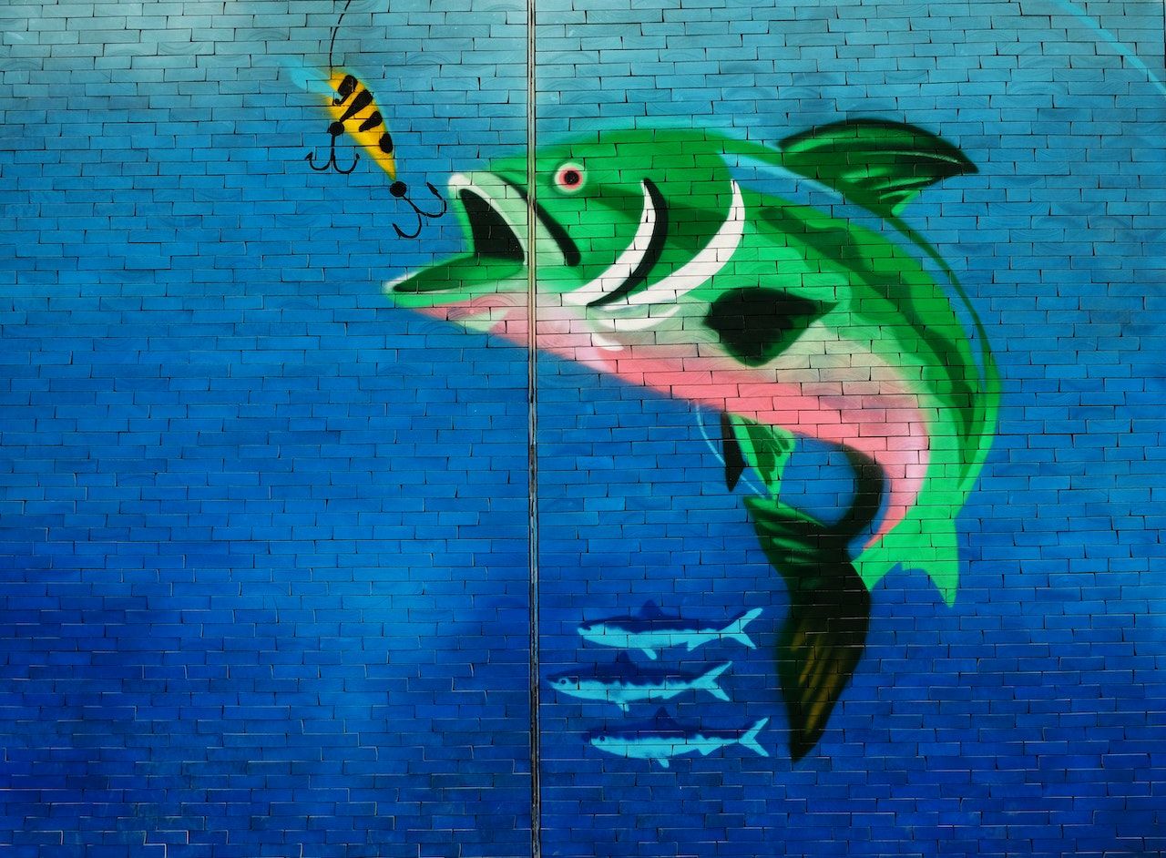 Wall Art of Green Fish About to Eat the Fish Hook 