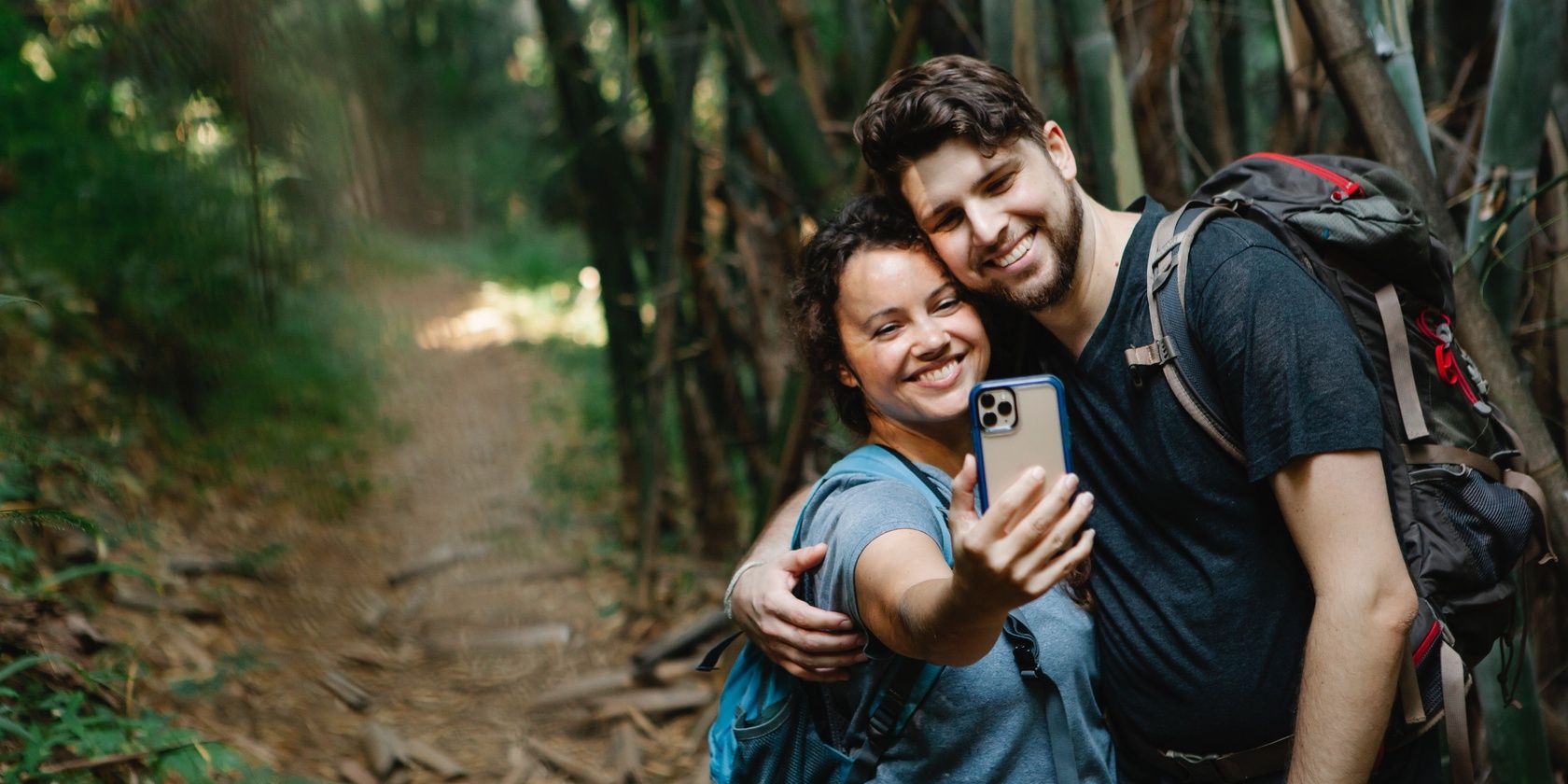 Backpacking couple taking selfie