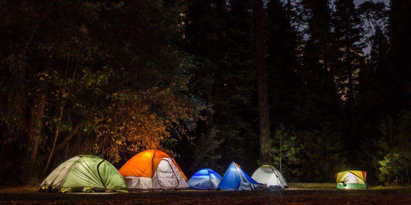 Six Camping Tents in Forest illuminated from within