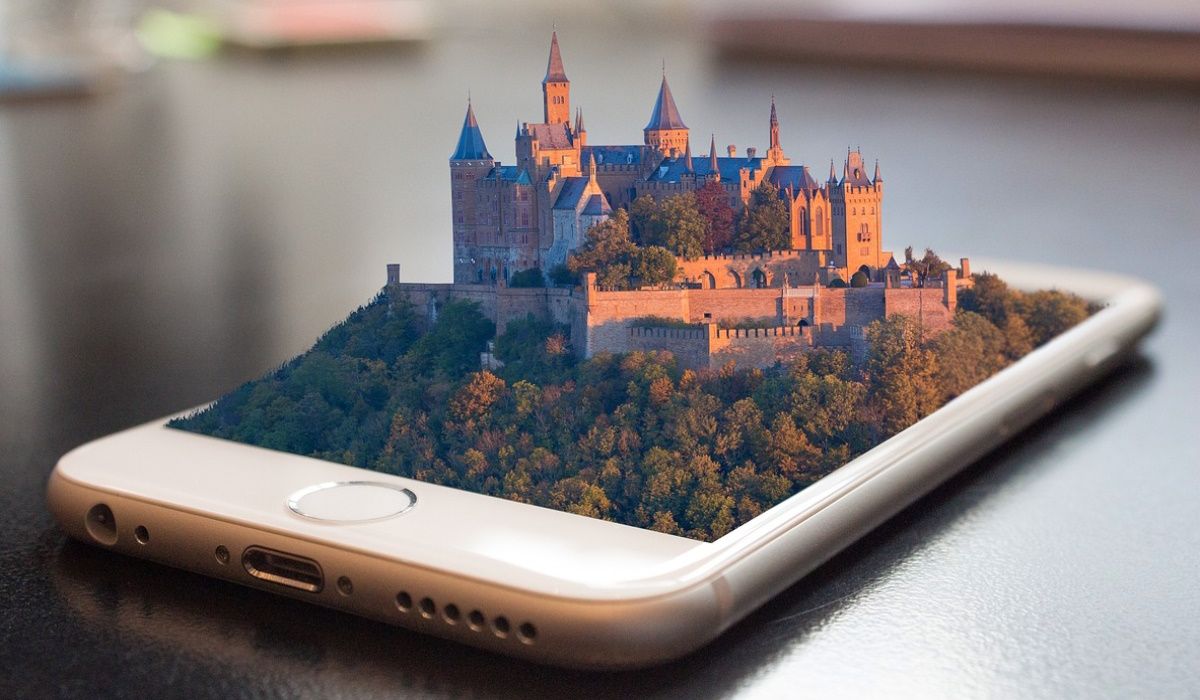 A virtual castle emerging from a smartphone