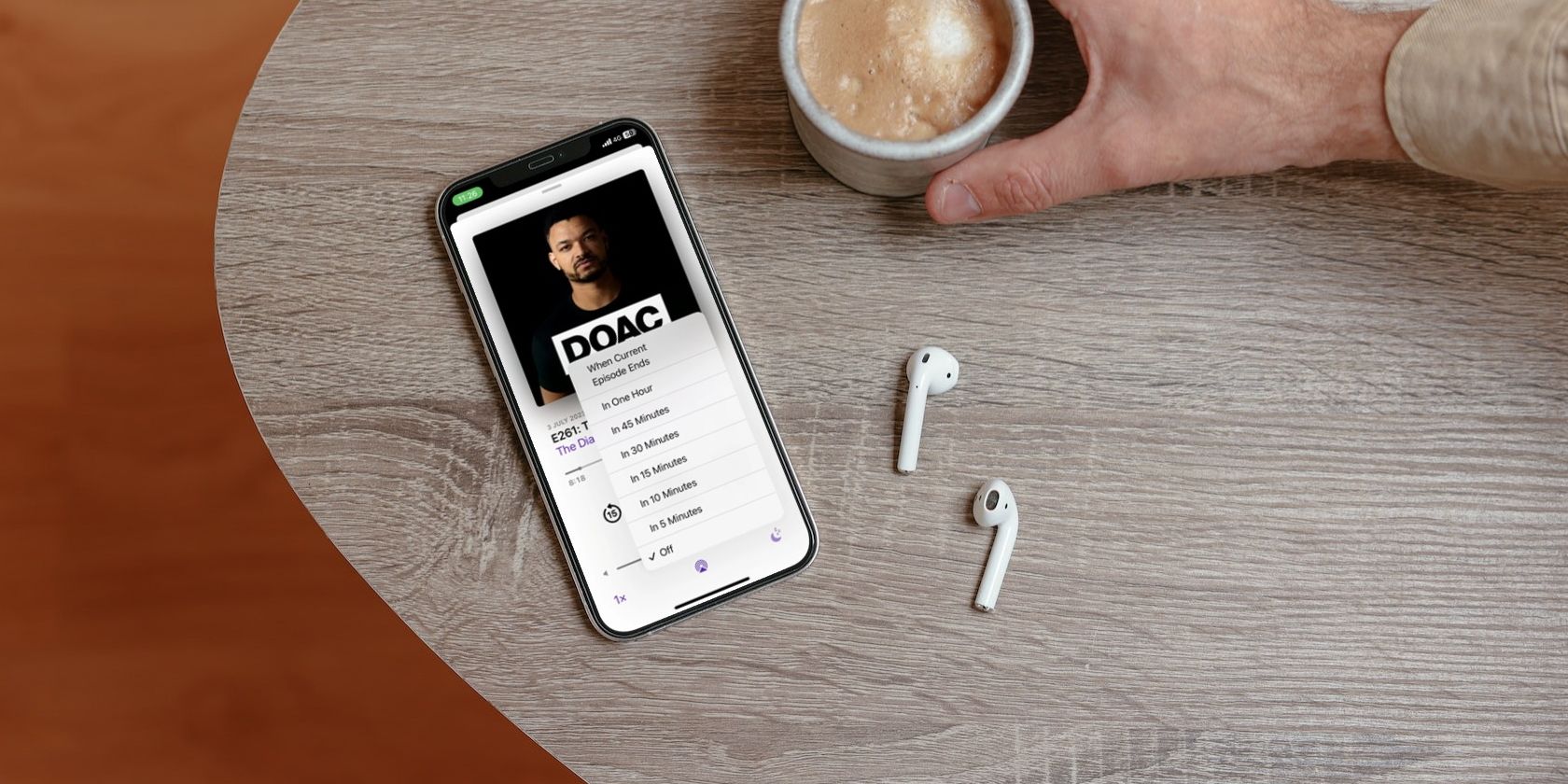 Apple Podcasts on an iPhone next to AirPods