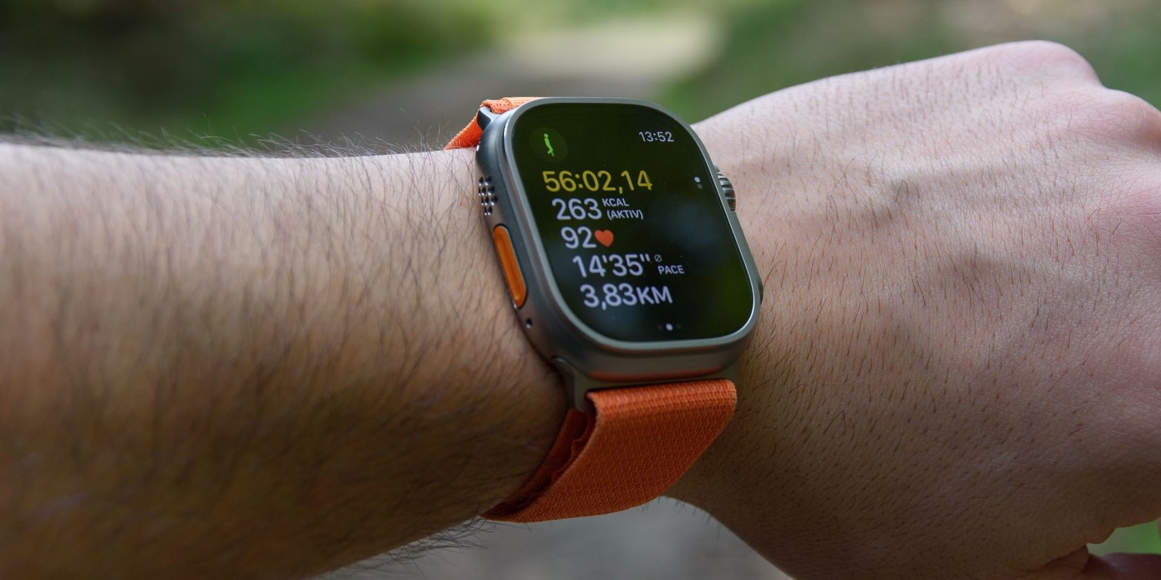 Apple Watch Ultra displaying activity notifications on a wrist