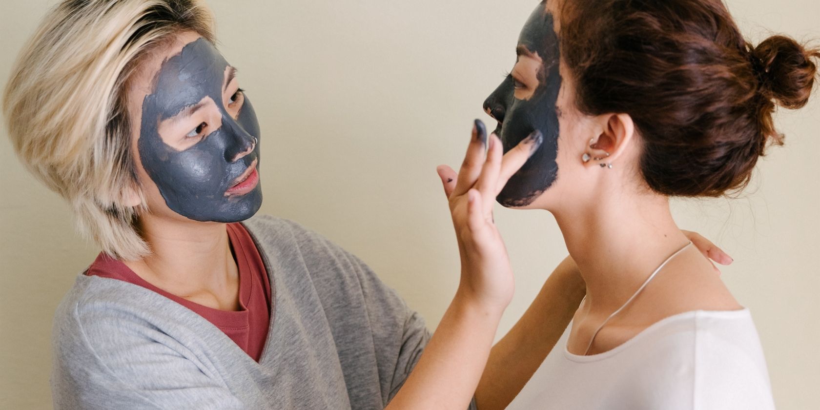 Women putting on face masks
