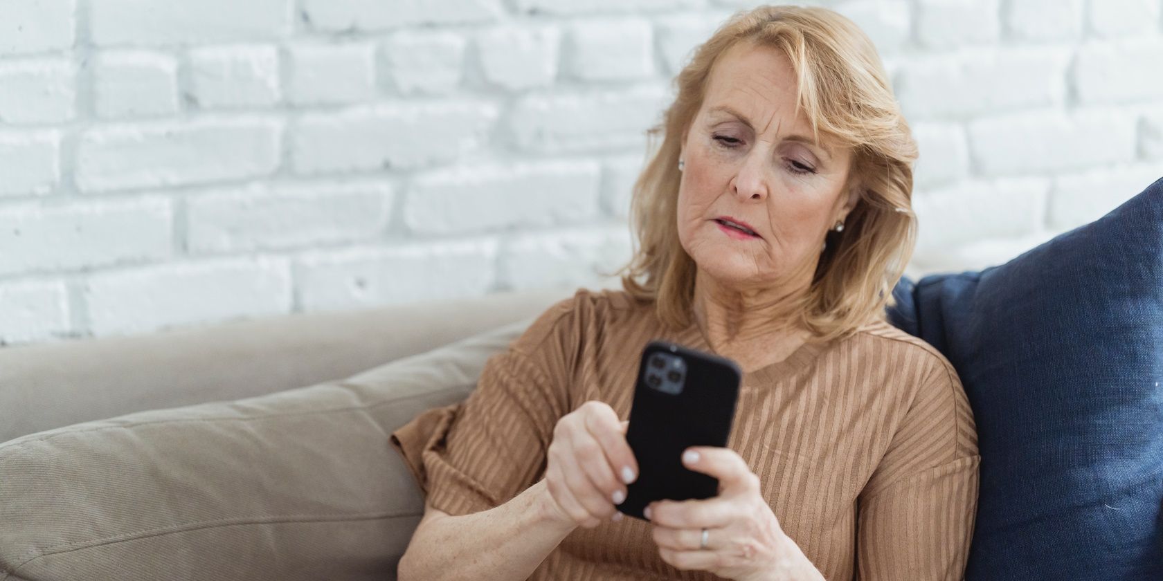 Elderly woman texting on a phone