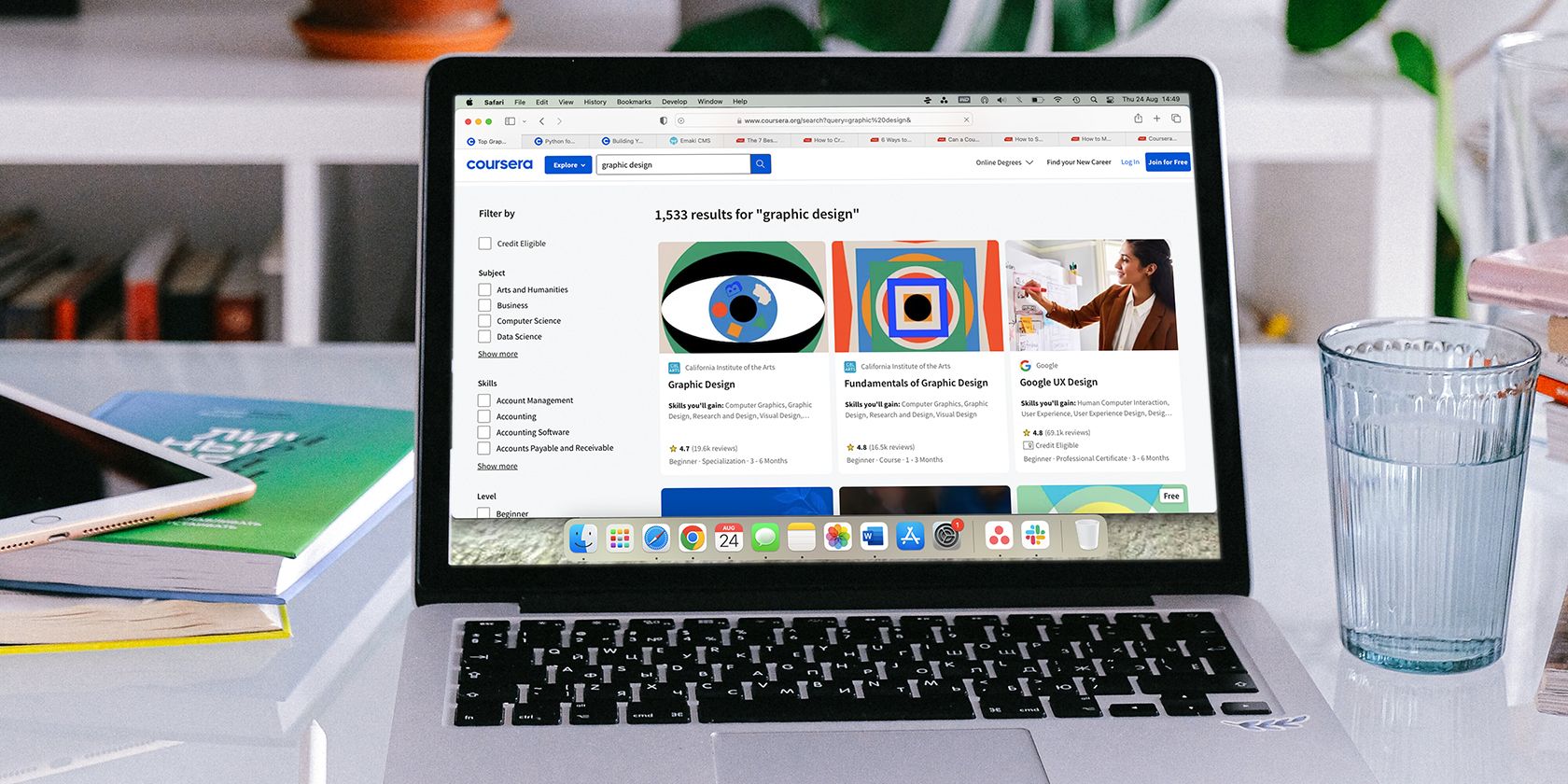 Coursera Graphic Design courses on MacBook screen.