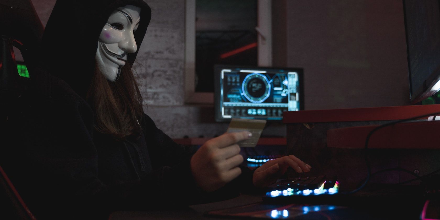 a cybercriminal in a guy fawkes v for vendetta mask