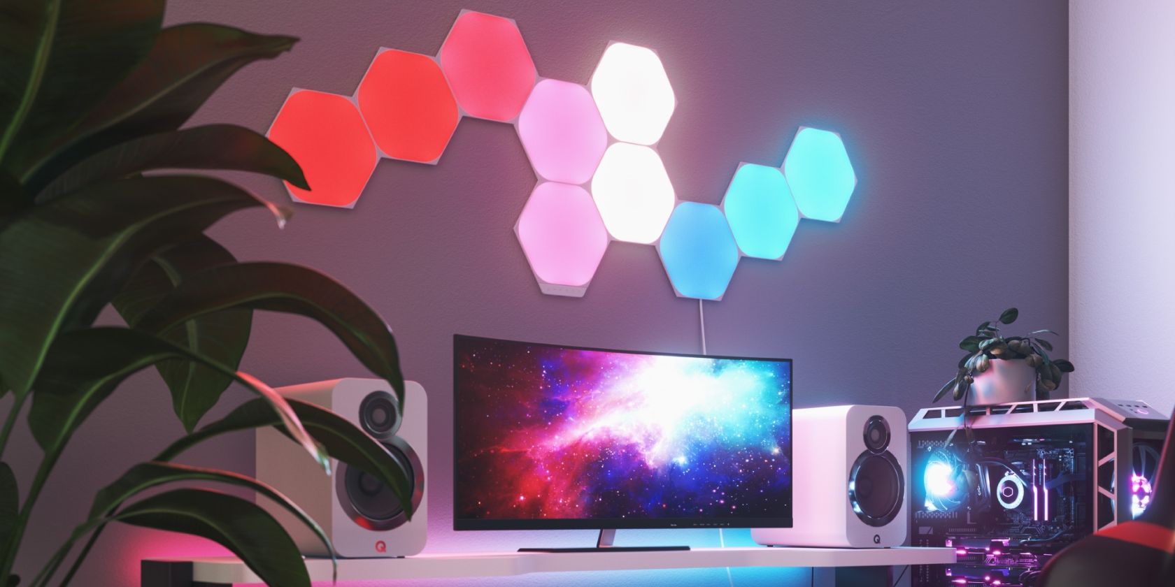 Nanoleaf Shapes Hexagons Illuminated Above a Computer Desk
