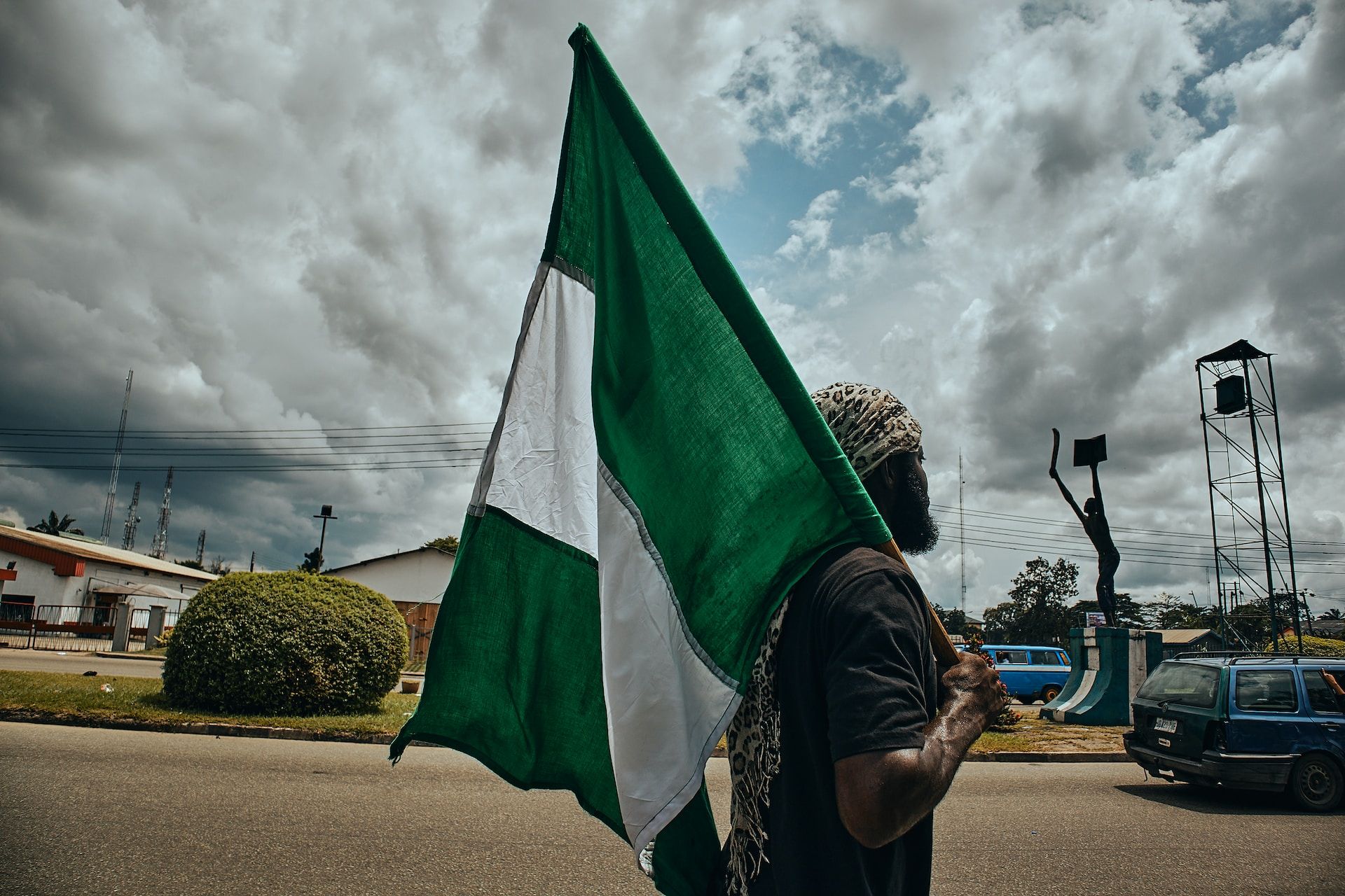 a protester with a Nigerian flag