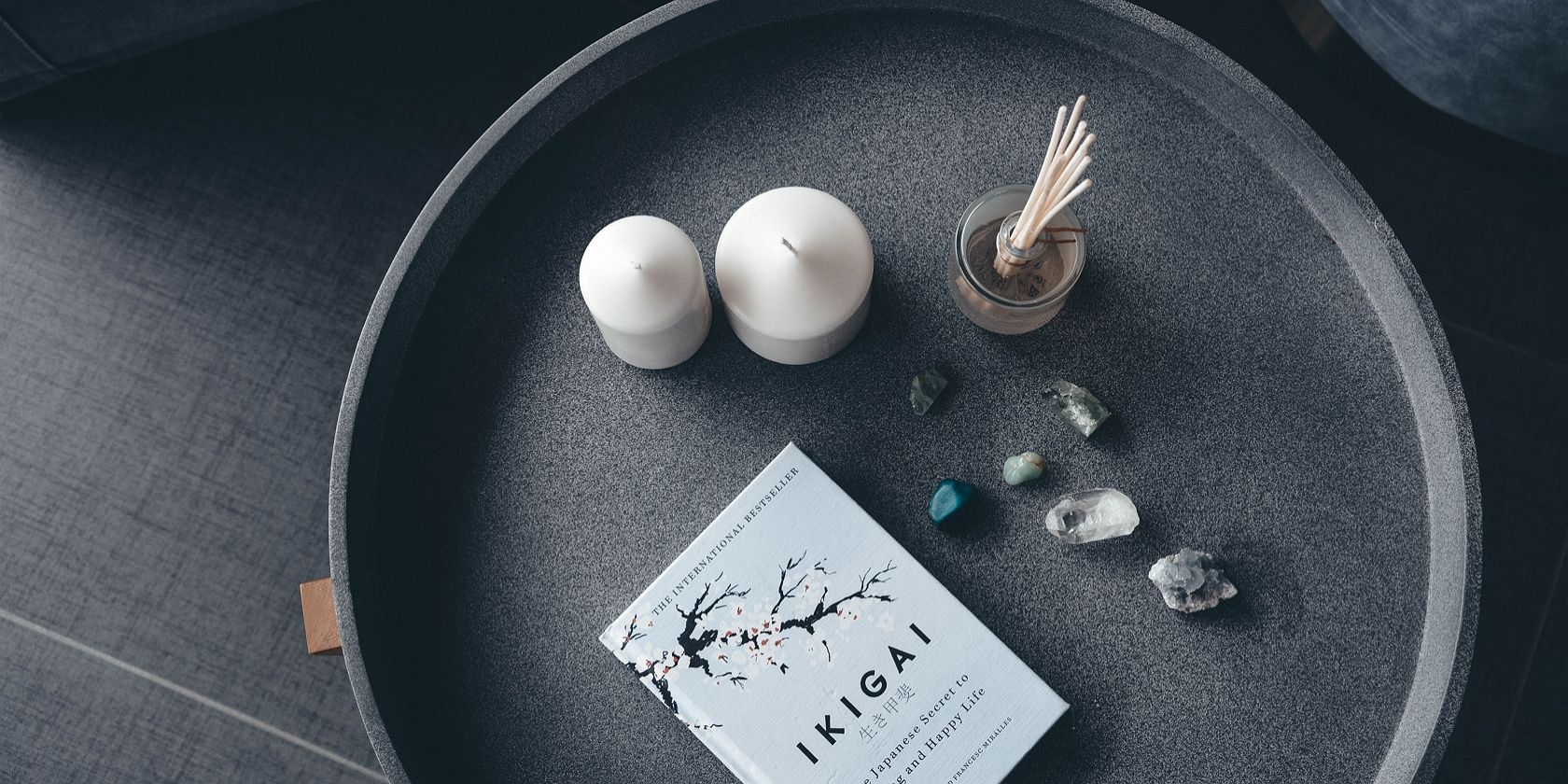 Candles, stone, and Ikigai book