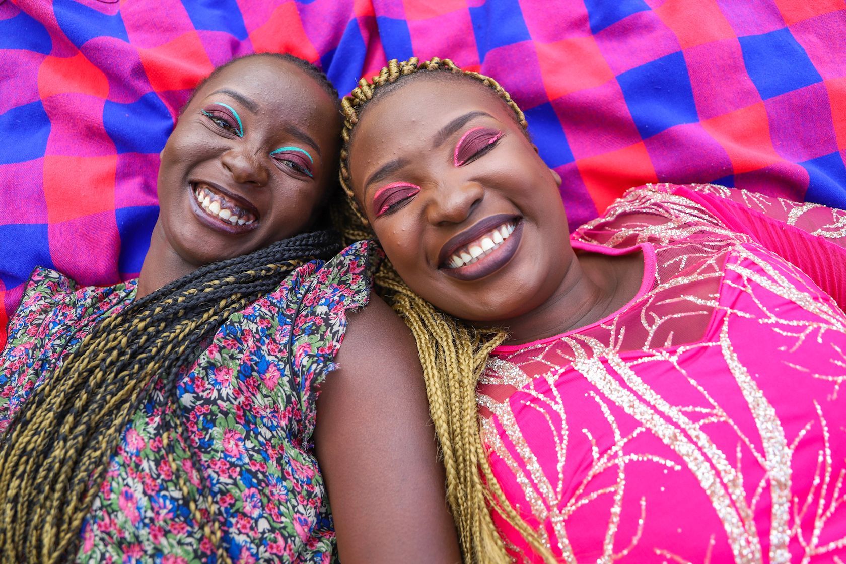photo of two smiling women wearing colorful clothing-1