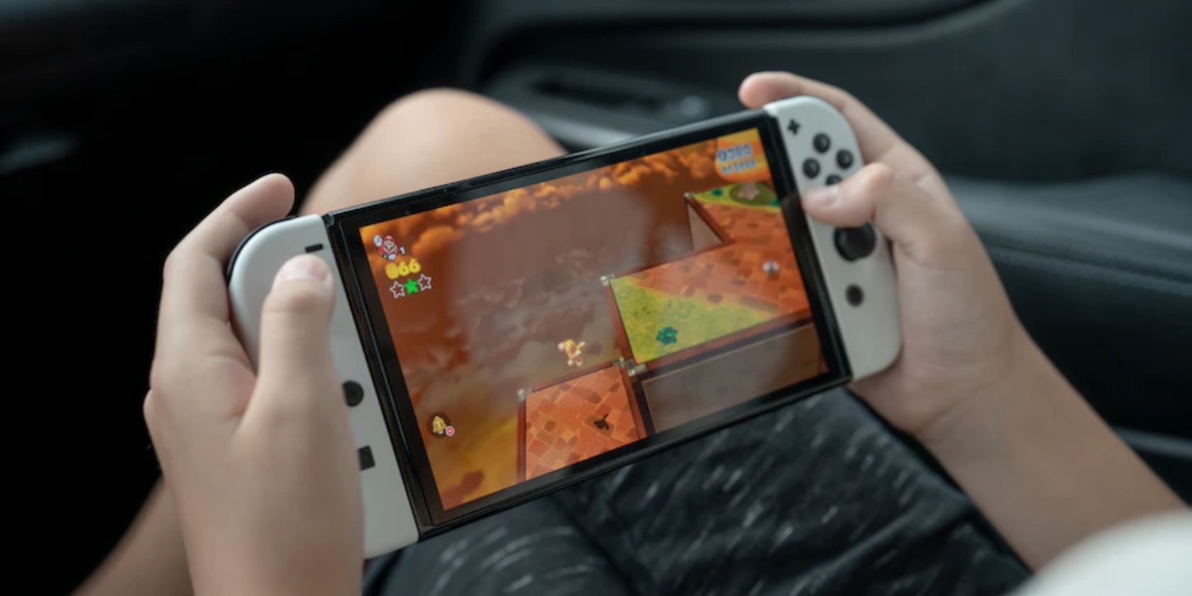 Someone playing a handheld game on a Nintendo Switch