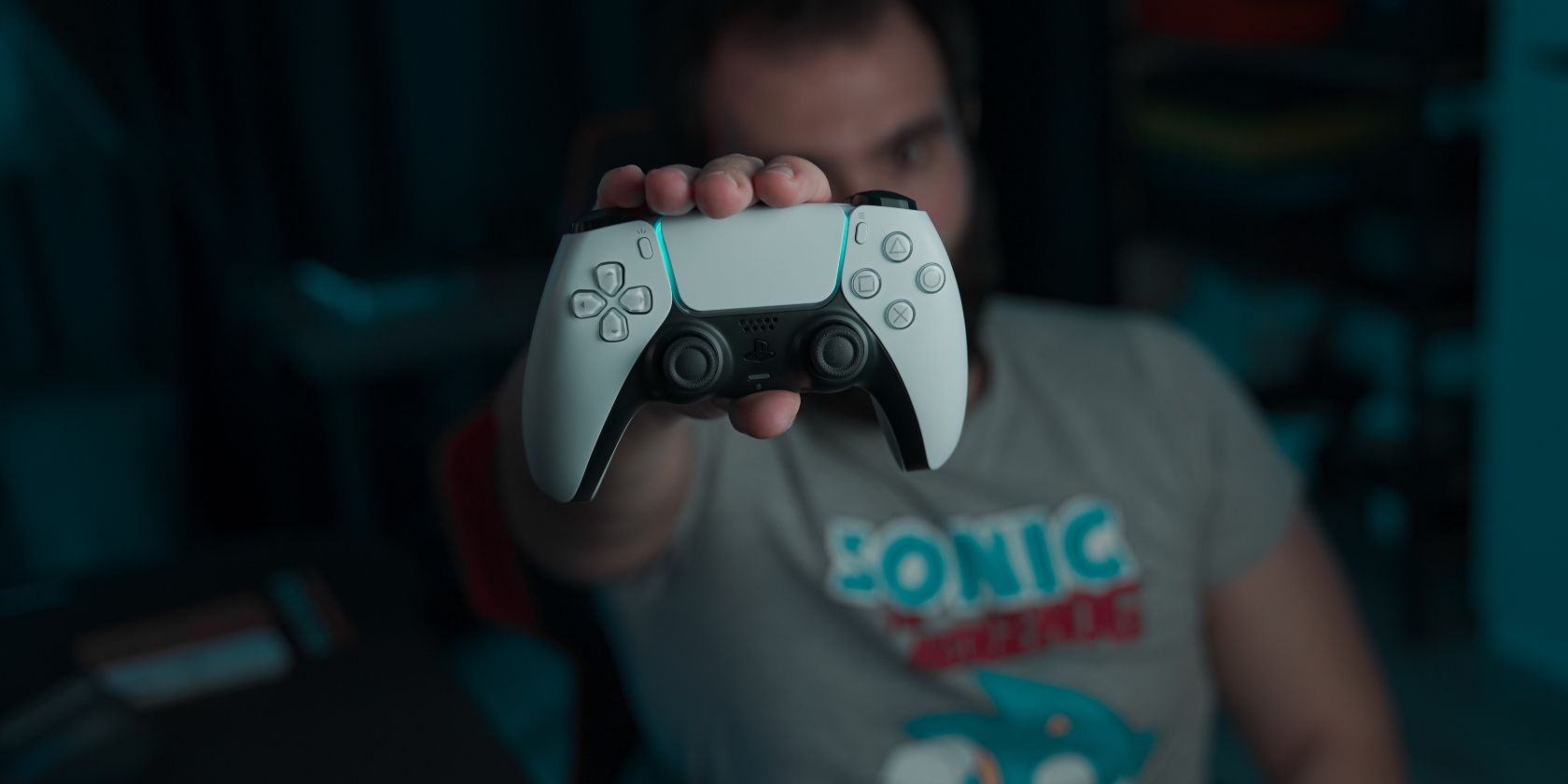PS5 DualSense controller in a man's hand