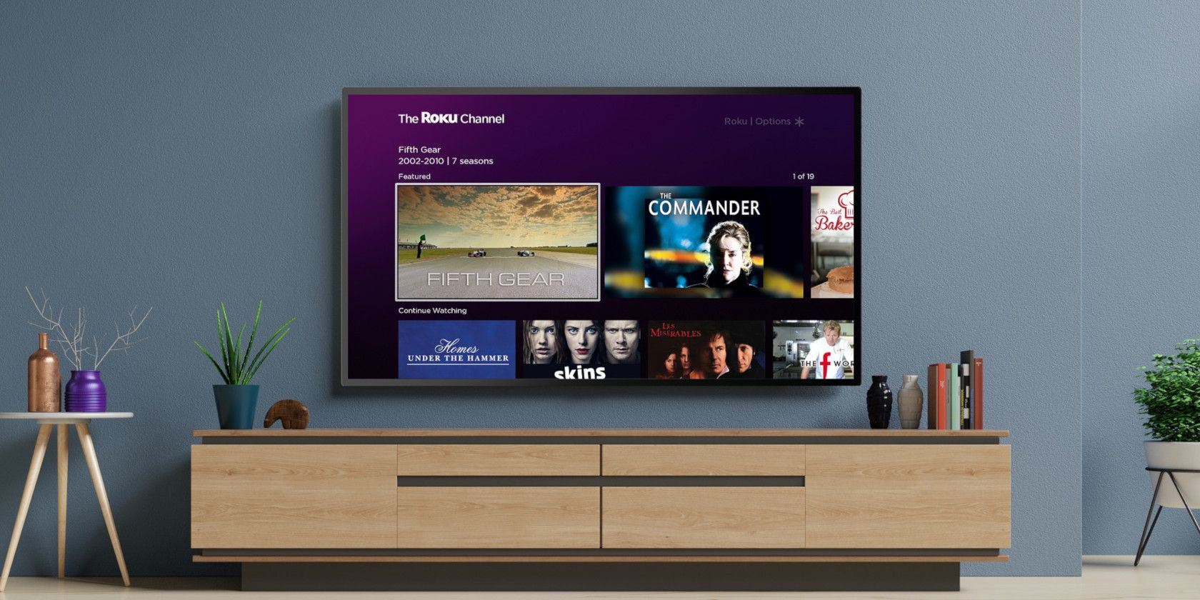 A wall-mounted television with Roku running