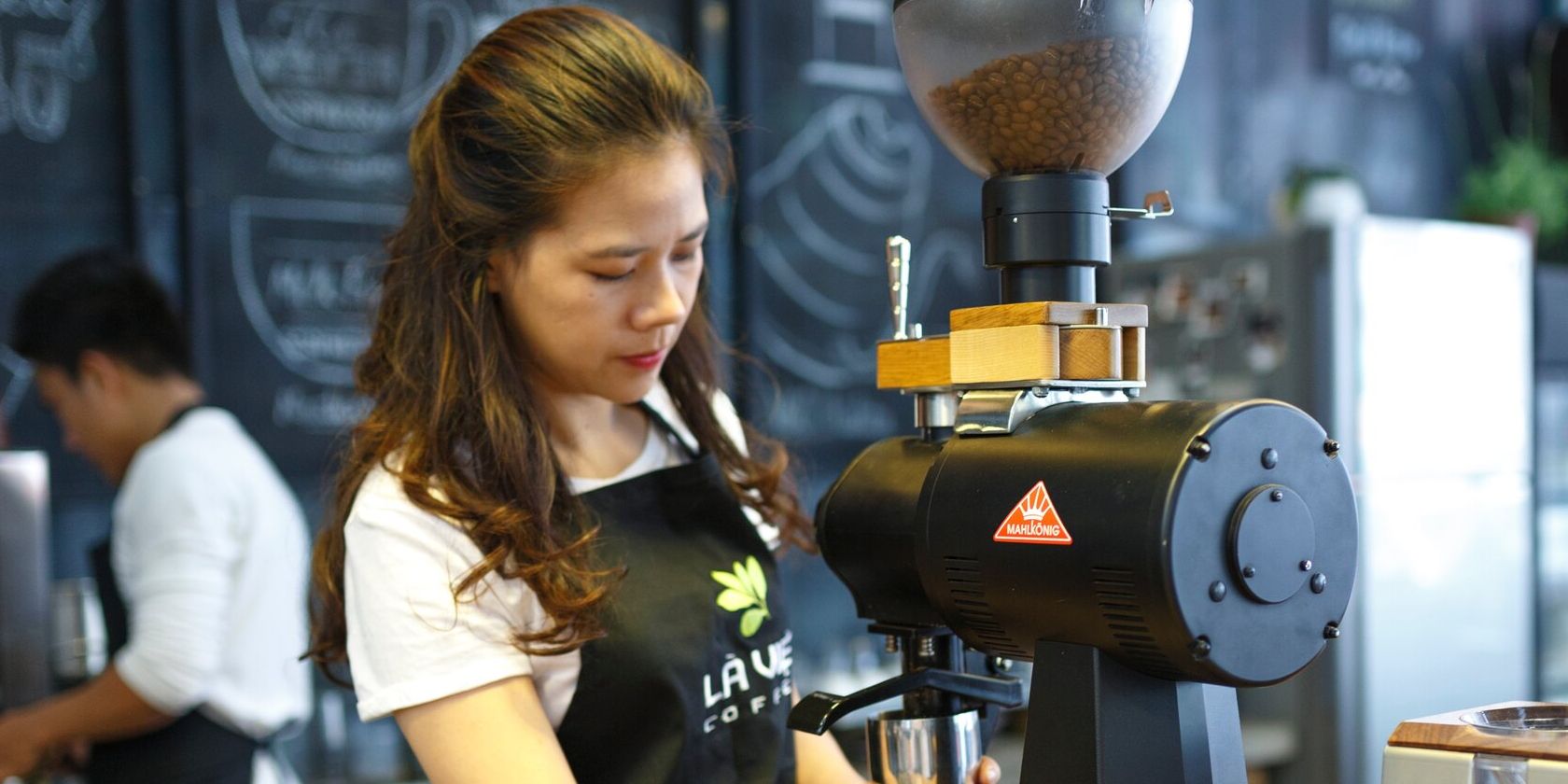 Woman working as a barista in a coffee shop