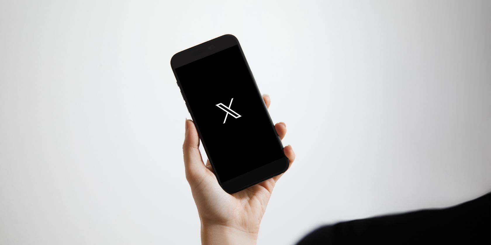 x twitter logo on smartphone
