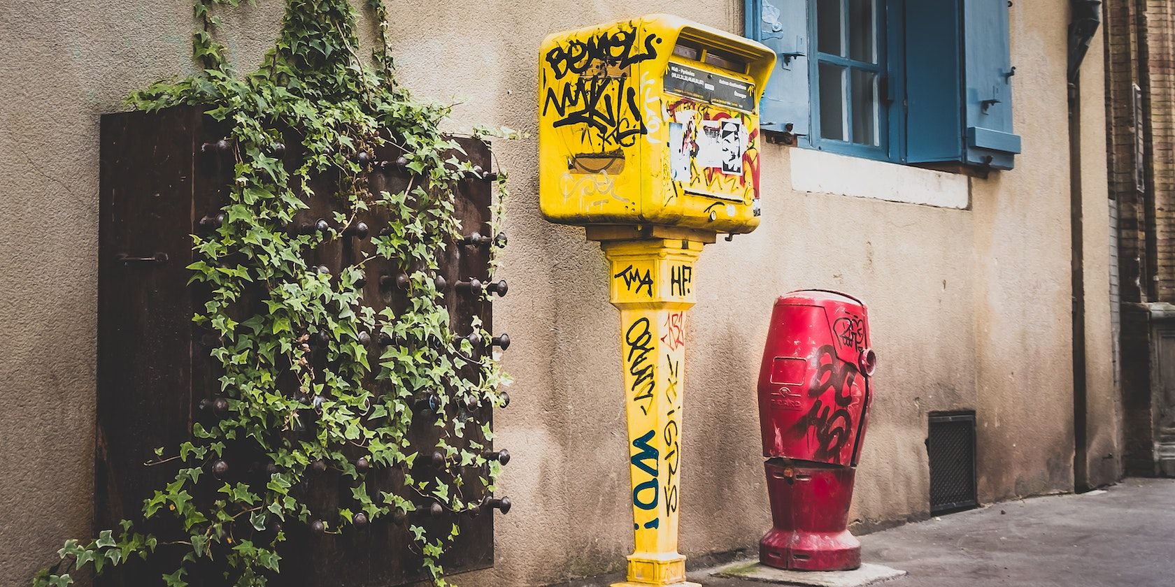yellow vandalised mailbox