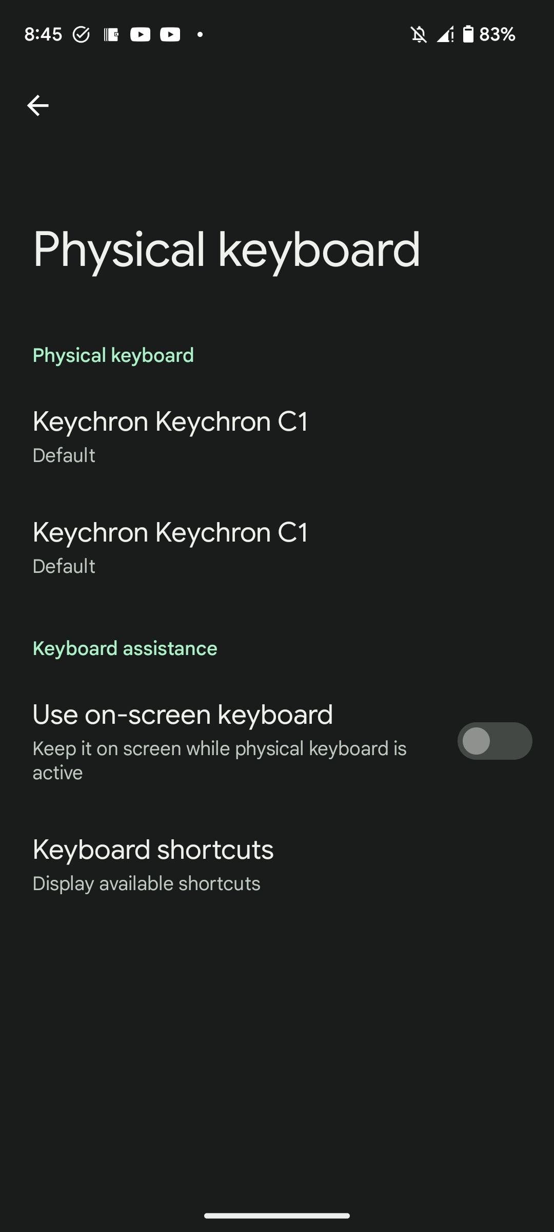 A physical keyboard connected to an Android phone