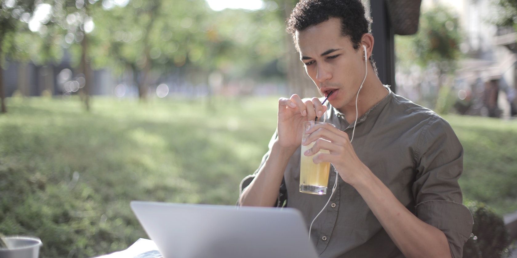 Man listening to music on a laptop