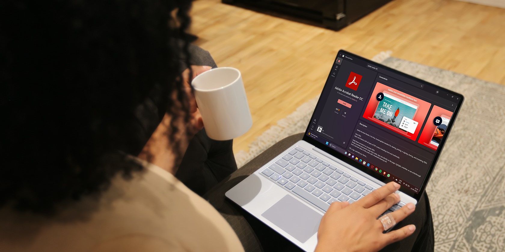 Woman Downloading Adobe Reader on Windows 11 Laptop