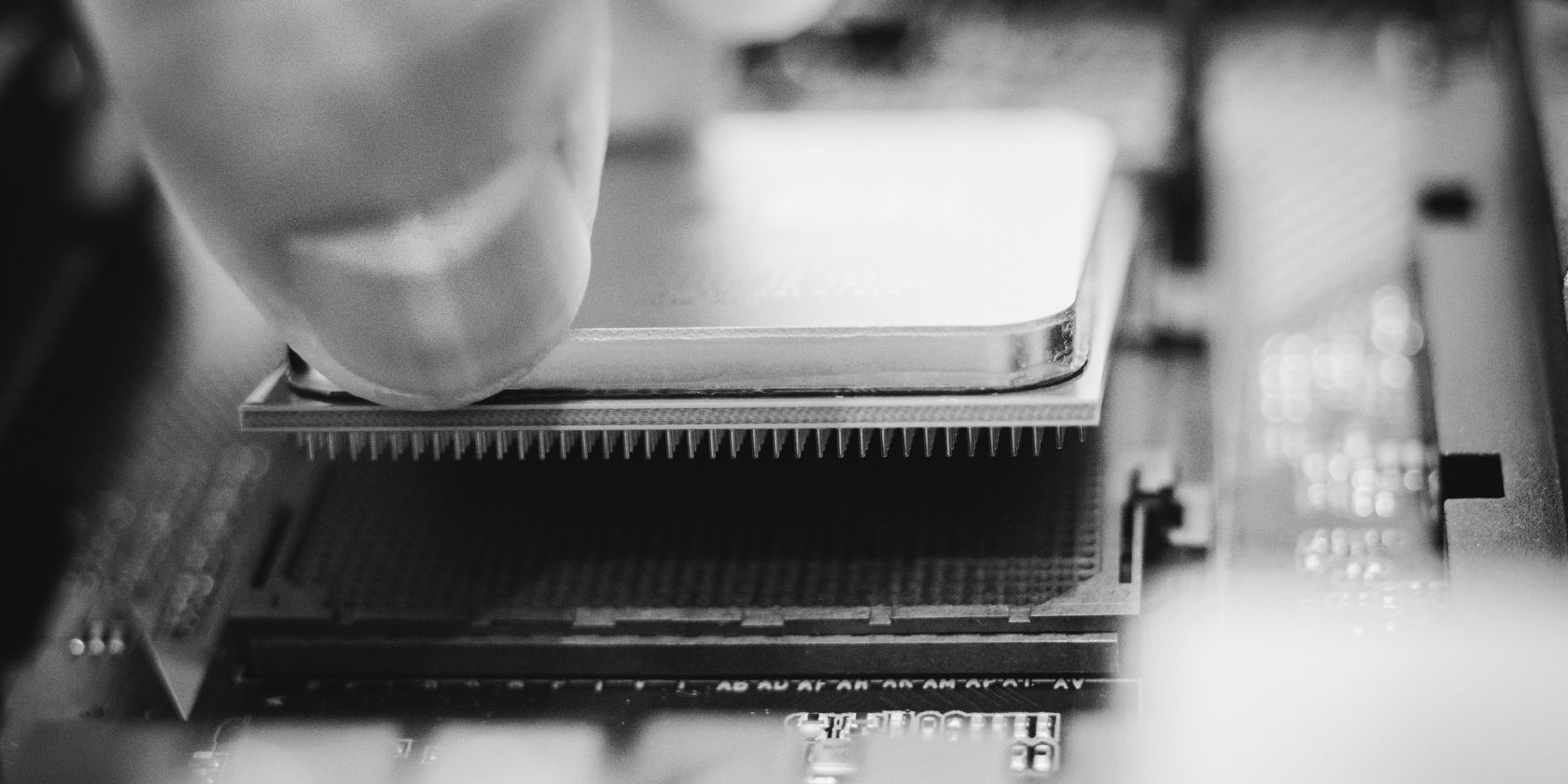 close up shot of person removing cpu from motherboard